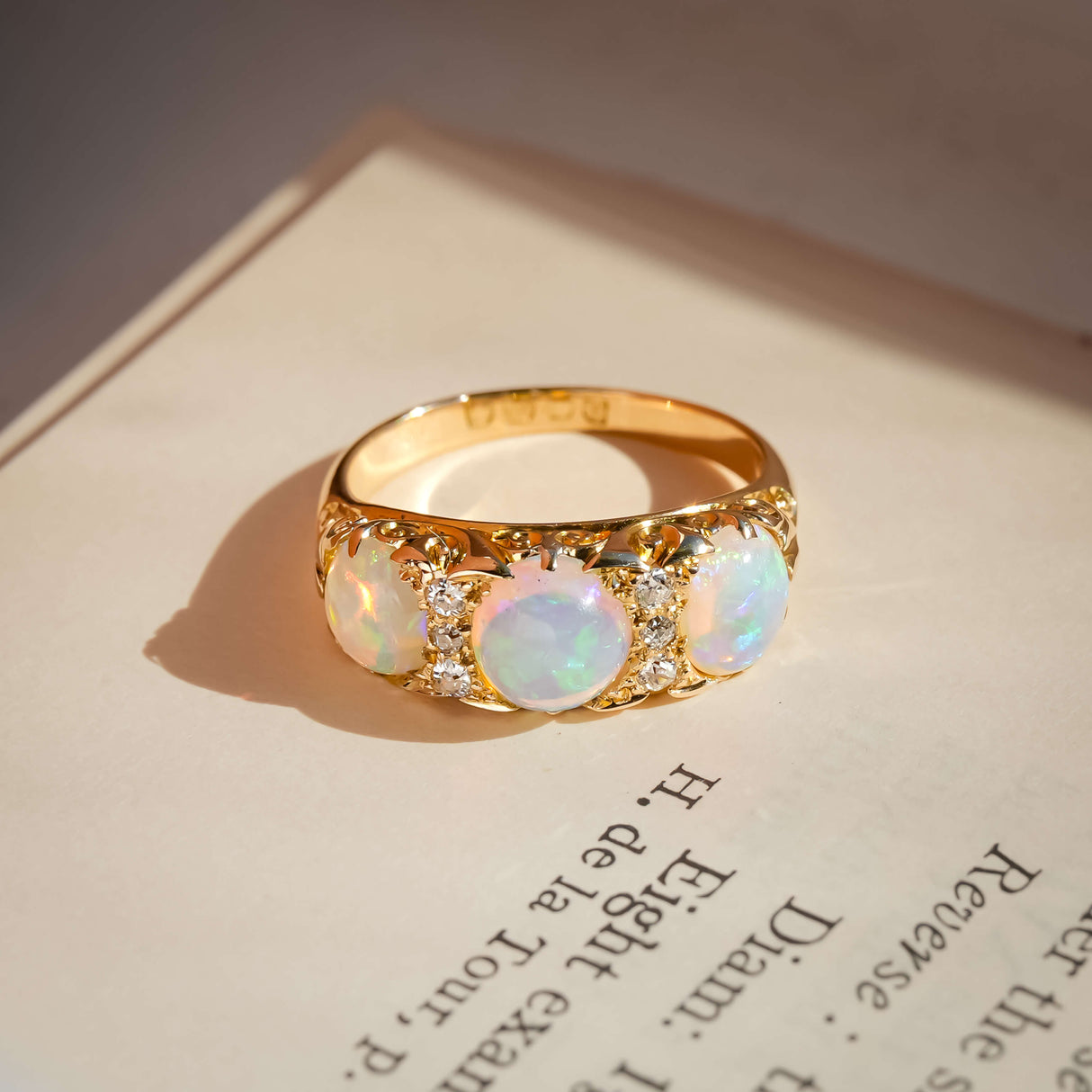 edwardian opal three stone diamond ring with antique design in yellow gold