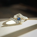Antique Edwardian sapphire and diamond twist ring featuring blue gemstone and diamond details