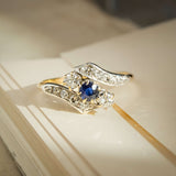 Edwardian sapphire and diamond twist ring with blue gemstone and diamond set curves