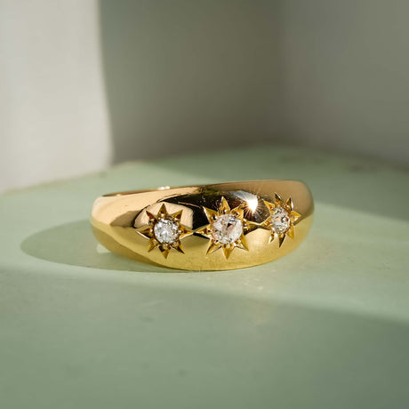 edwardian three stone diamond gypsy ring with yellow gold band