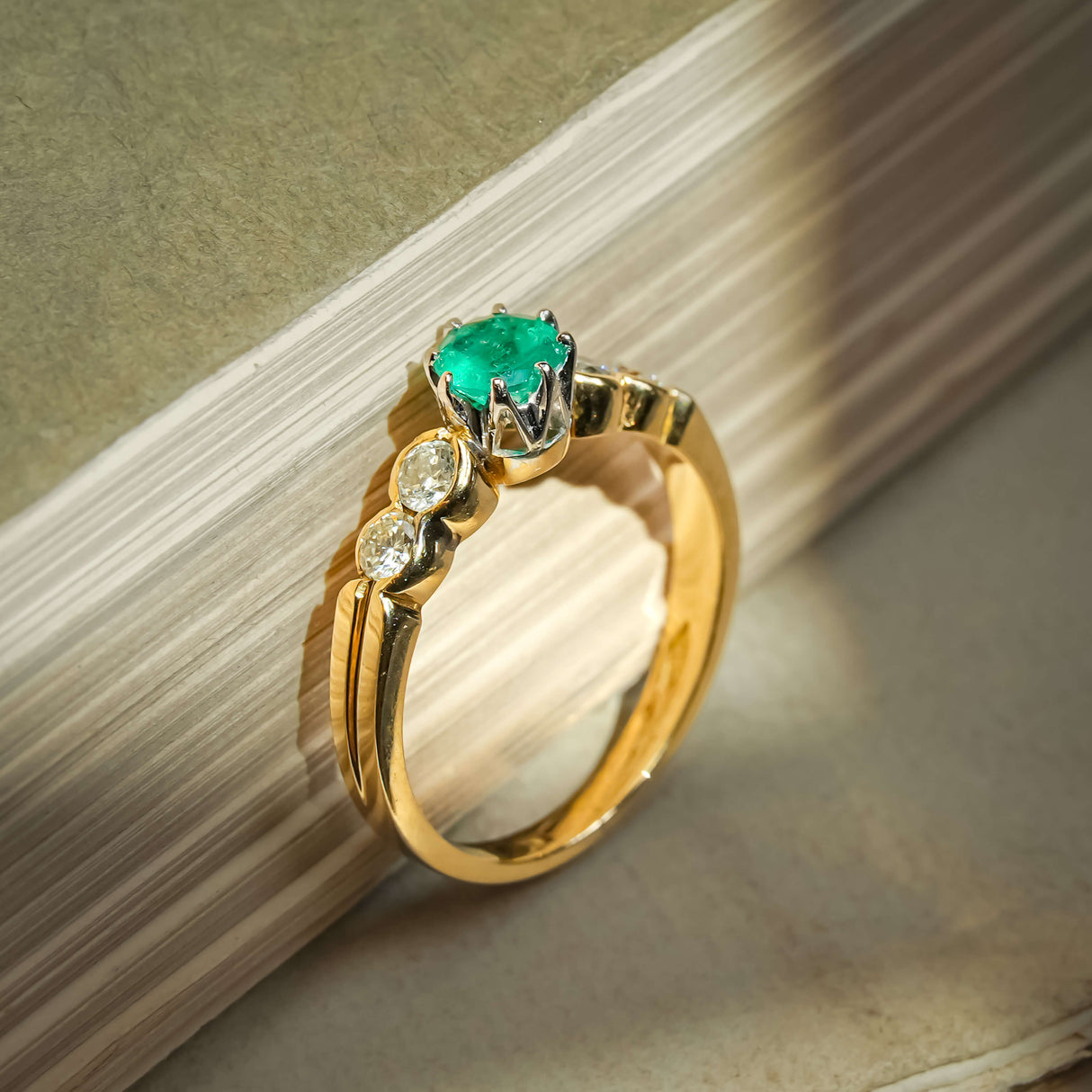 Vintage 1990s emerald and diamond five stone ring with round green emerald and diamond accents