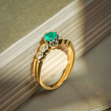 Vintage 1990s emerald and diamond five stone ring with round green emerald and diamond accents