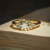 Fancy light yellow diamond ring with trefoil cluster design and white diamonds