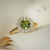 Green sapphire cluster ring with diamond halo and slim gold band