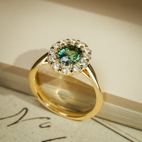 Green sapphire and diamond cluster ring with yellow gold band
