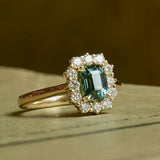 Green sapphire engagement ring with diamond halo cluster vintage inspired design
