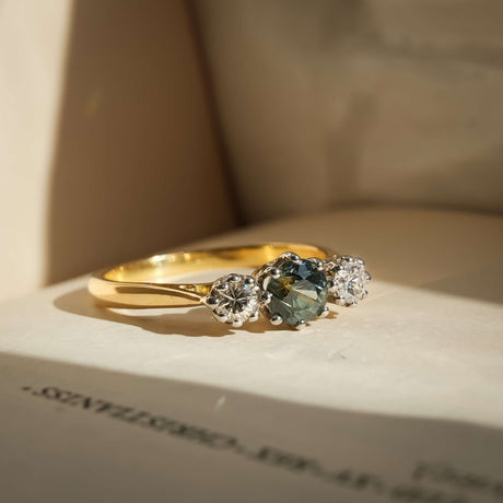 green sapphire three stone diamond ring with vintage 1950s design in yellow gold
