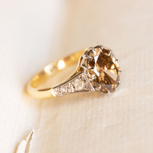 Antique-inspired hazelnut-brown diamond engagement ring with rose-cut diamond accents and yellow gold band.