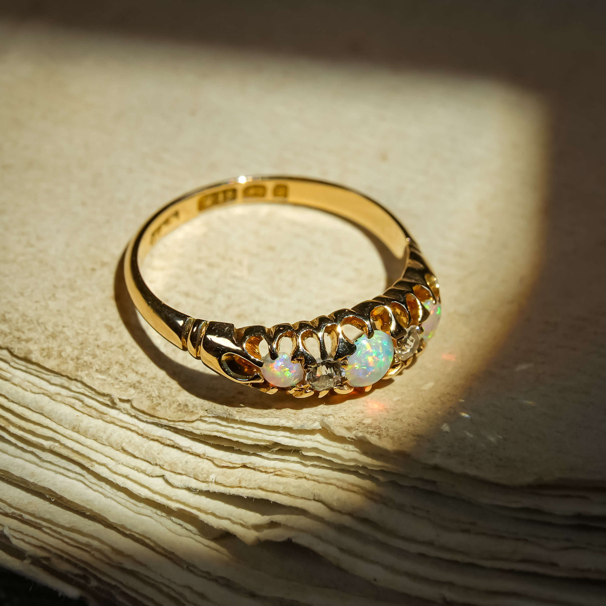 Late Victorian opal and diamond five stone ring with graduating opals in gold setting