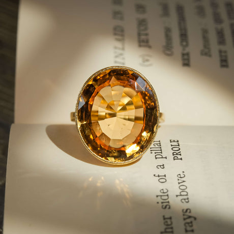 19th century orange topaz solitaire ring with oval marmalade orange gemstone