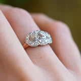 Diamond cluster ring detail highlighting old cut stones and intricate setting.