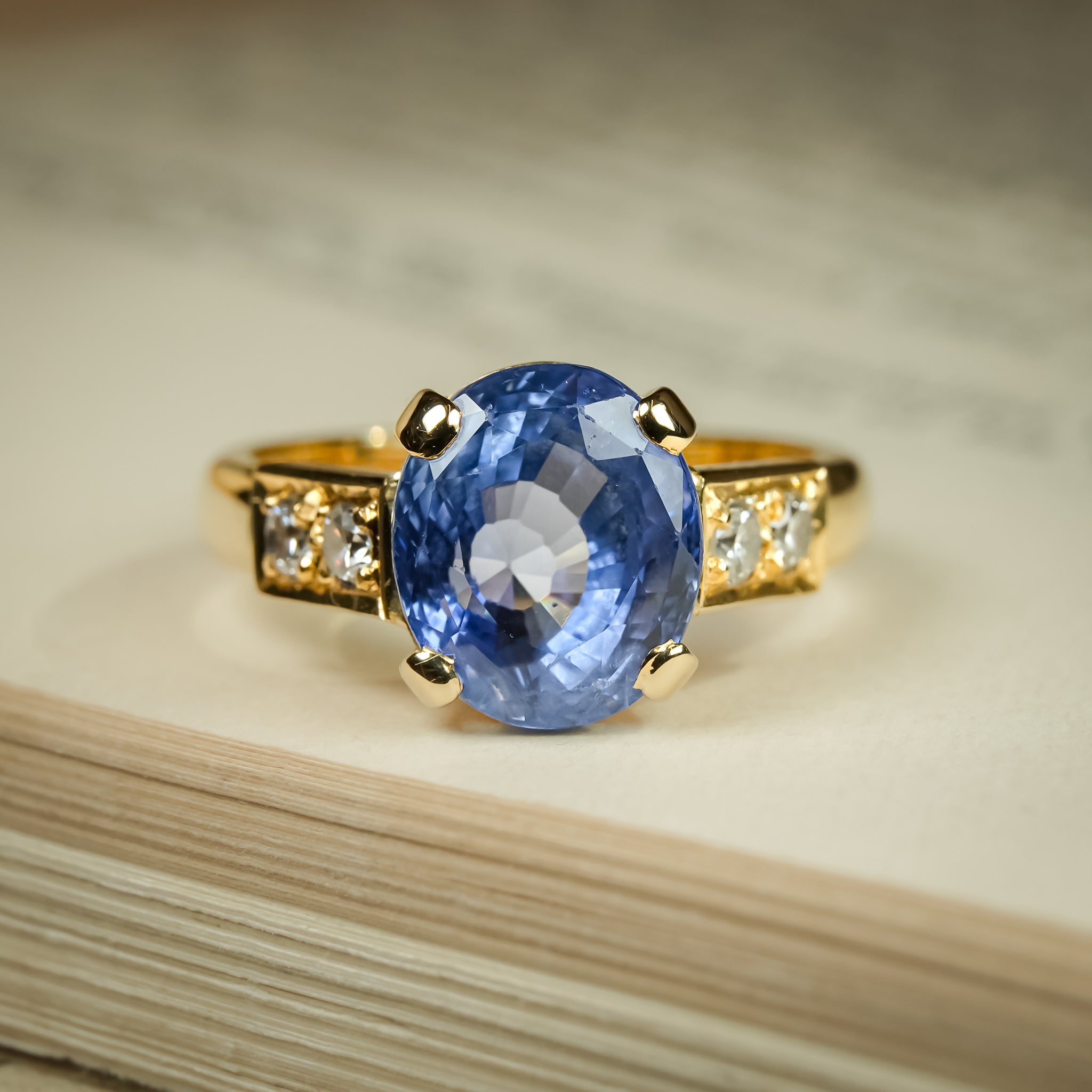 Oval blue sapphire engagement ring with diamond accents from 1990s