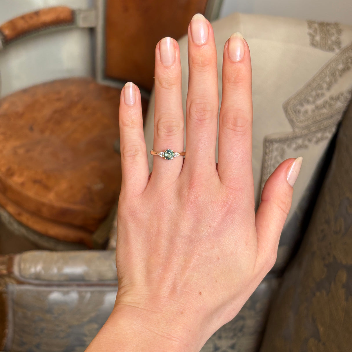 Oval Sri Lankan green sapphire and diamond wed-fit engagement ring in polished yellow gold.