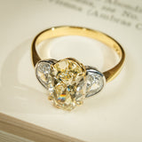 Oval yellow diamond three stone ring with half moon diamonds in gold band