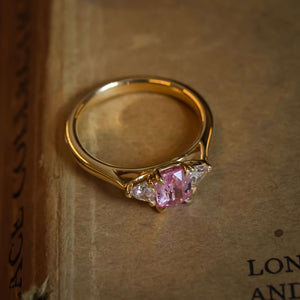 Padparadscha sapphire three stone diamond engagement ring with vintage style setting