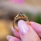 Pine green sapphire and diamond engagement ring with oval green sapphire centre stone.
