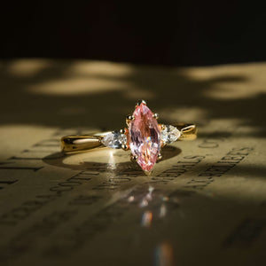 pink sapphire marquise diamond three stone ring with tapered diamond accents