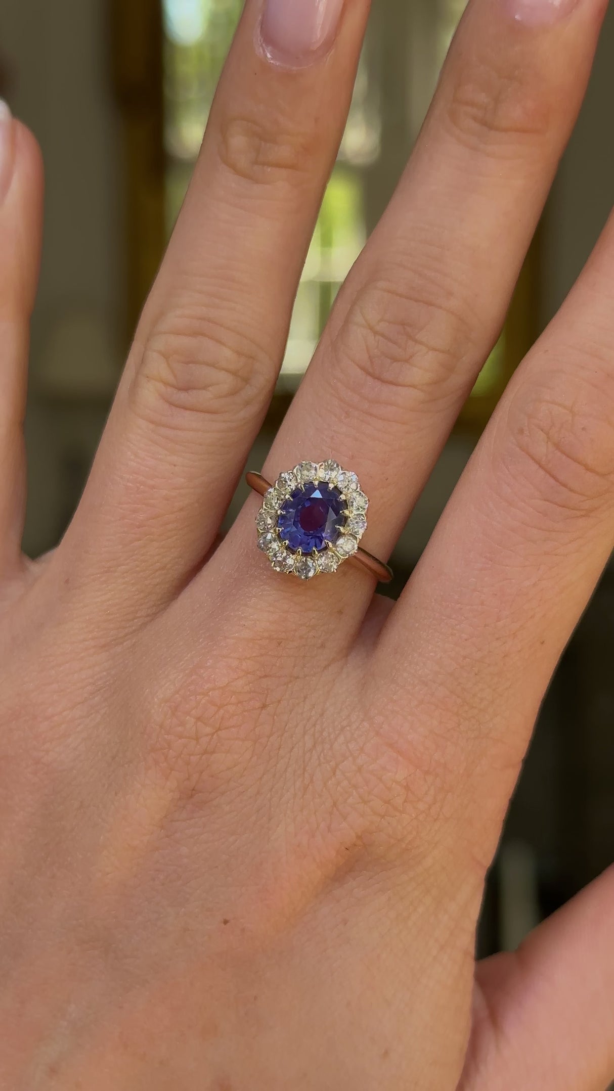 Antique, colour change oval sapphire and diamond cluster engagement ring