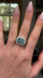 Aquamarine and diamond cocktail ring worn on hand and moved around to give perspective.