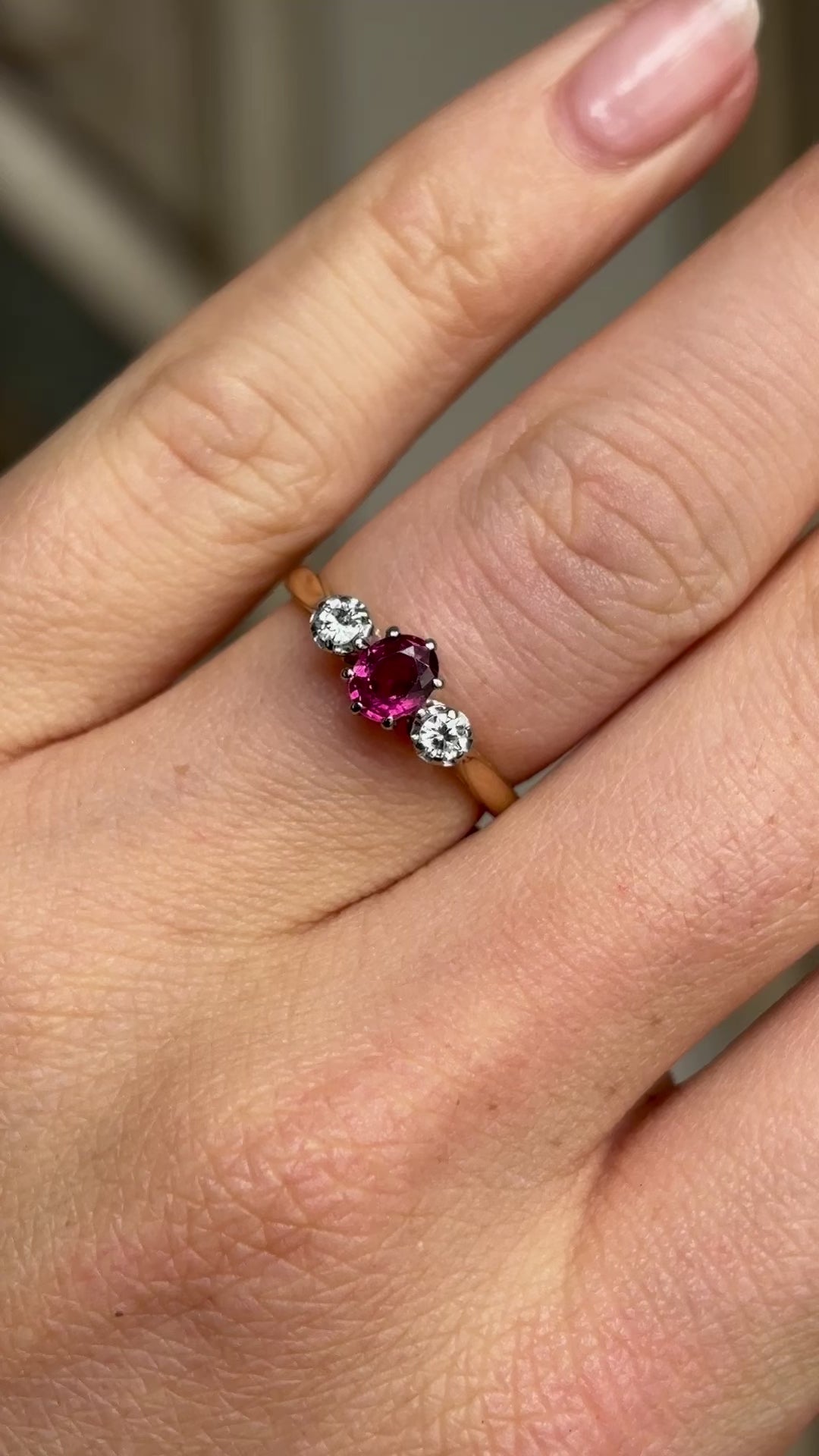 Antique, Edwardian ruby & diamond three-stone ring worn on hand