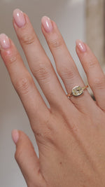A video of the old mine-cut diamond ring worn on a finger, capturing the gemstone's sparkle and classic yellow gold setting.
