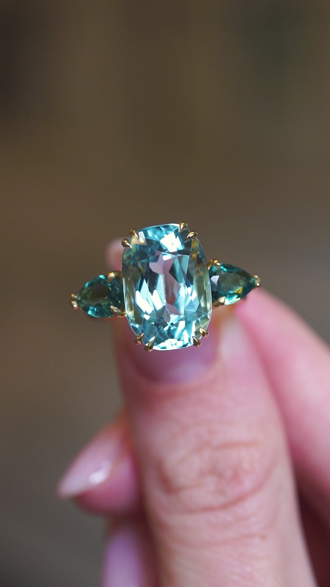 Aquamarine and sea-green tourmaline three-stone cocktail ring