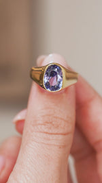 Video close-up of the Victorian sapphire ring balanced on a fingertip, highlighting its bold signet-style silhouette.
