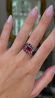 Georgian garnet cluster ring worn on hand and moved around to give perspective.