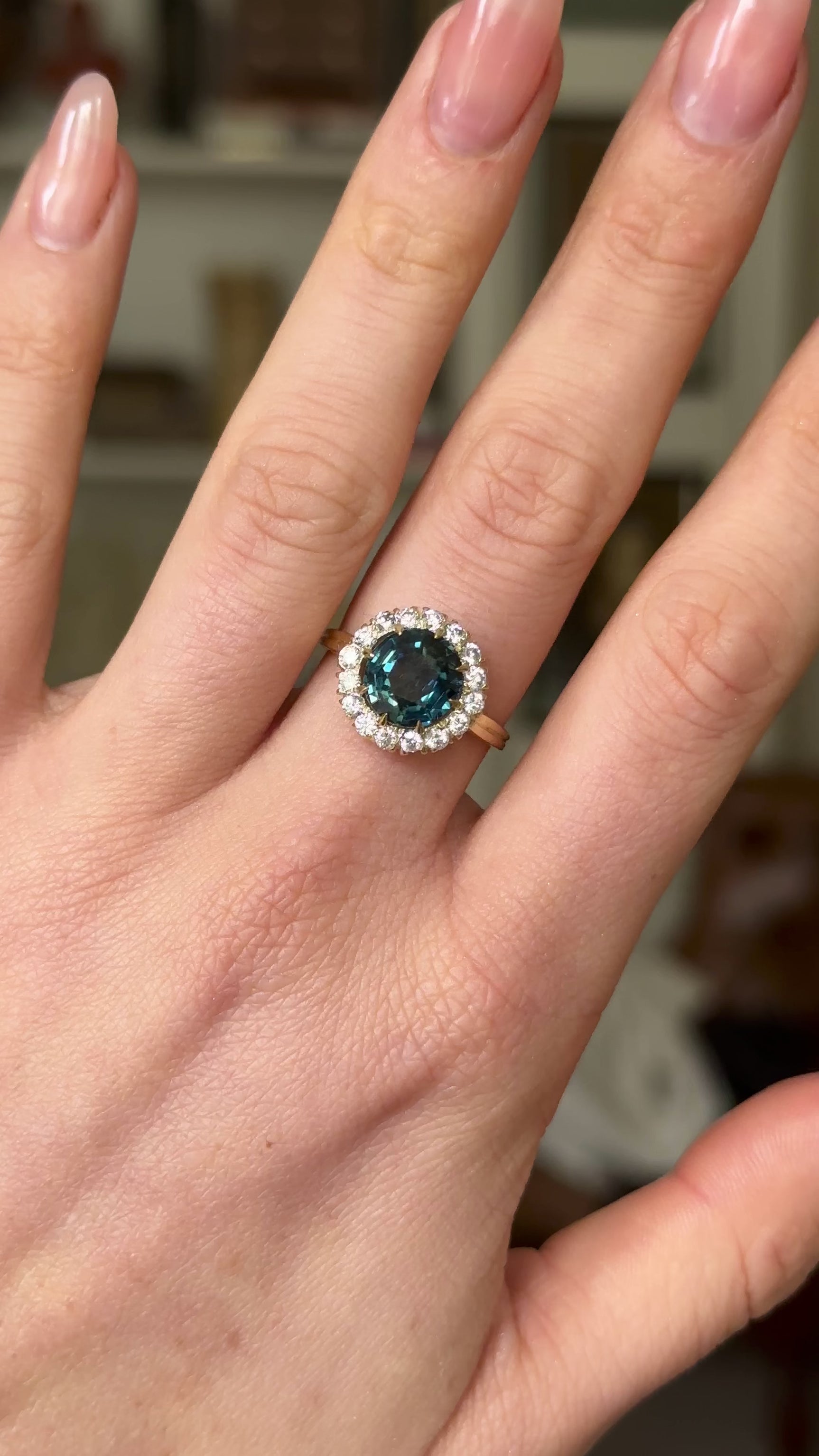 Antique, Teal Blue Sapphire and Diamond Cluster Ring, 18ct Yellow Gold worn on hand and rotated to give perspective.