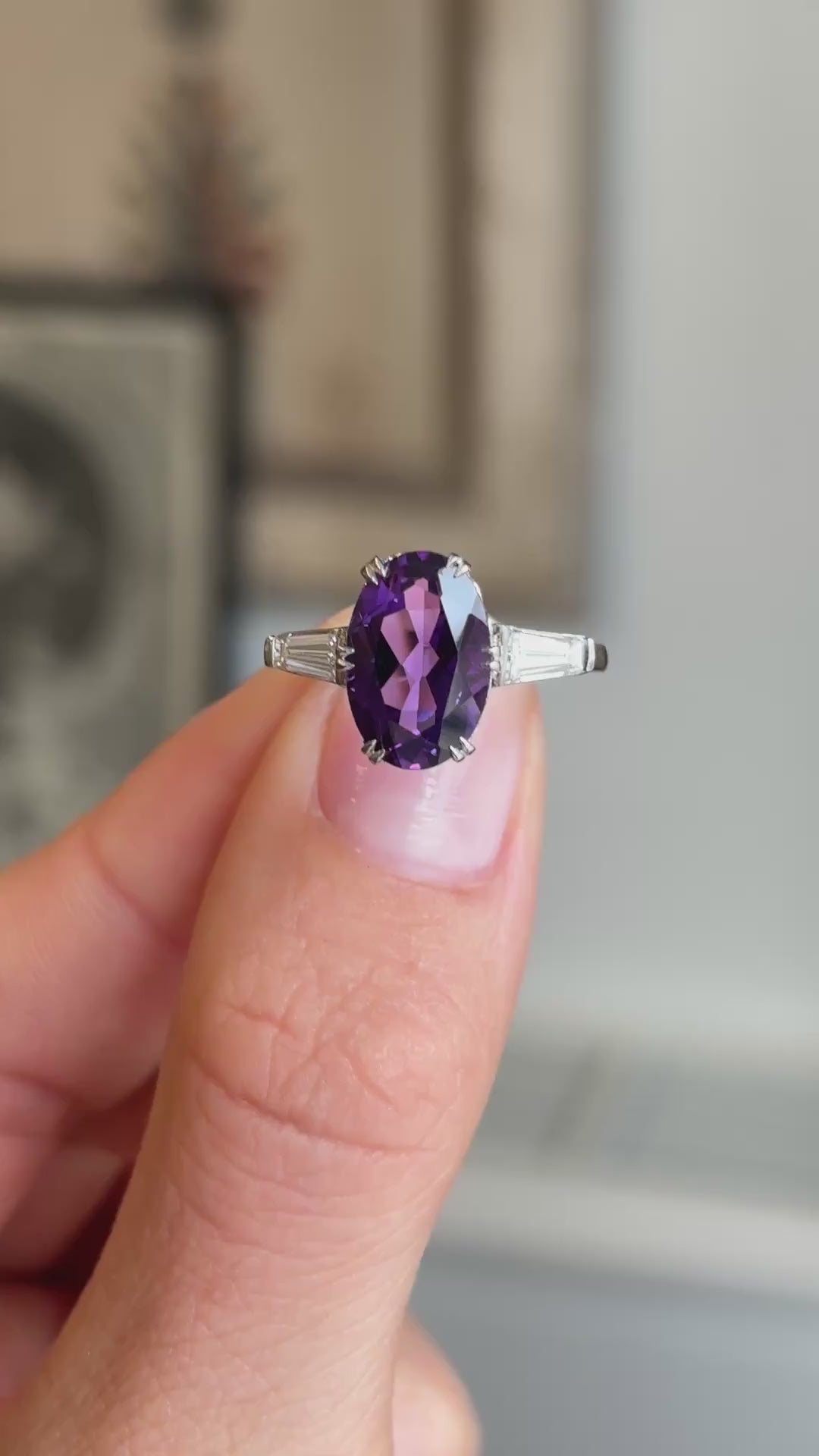 Close-up video of an antique Art Deco platinum ring showcasing a vivid purple amethyst accented by brilliant diamonds, highlighting colour, sparkle and elegant 1930s craftsmanship.