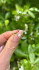 Vintage, 1930s Solitaire Old Cut Diamond Engagement Ring, 18ct Yellow Gold and Platinum held in fingers.