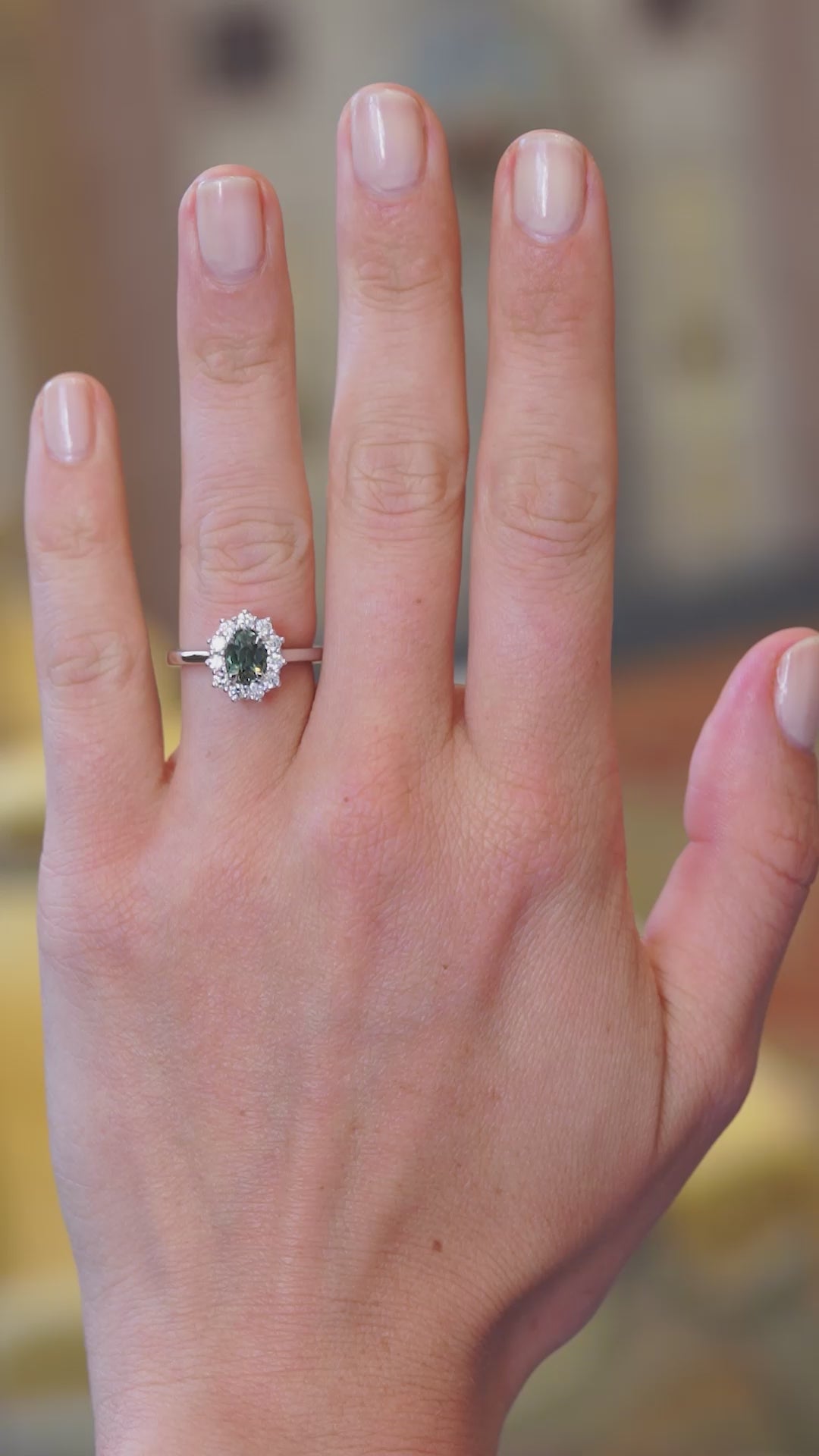 Green sapphire cluster ring worn on hand showing colour tone and natural movement.