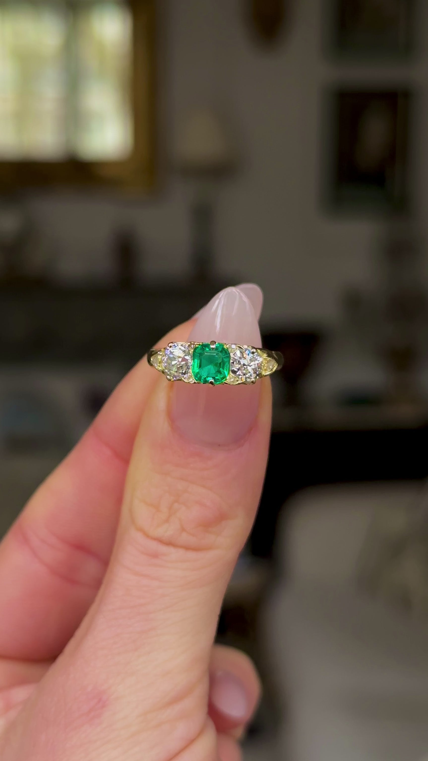 Antique, Edwardian Emerald and Diamond Three Stone Ring, 18ct Yellow Gold held in fingers and rotated to give perspective.