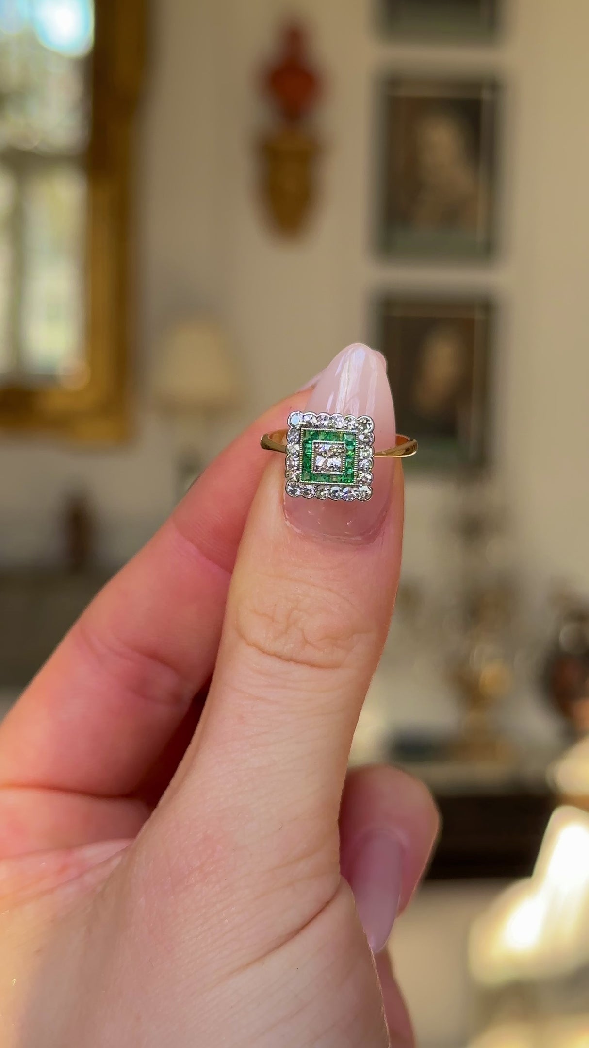 Antique, Emerald and Diamond Square Cluster Ring, 18ct Yellow Gold and Platinum held in fingers and rotated to give perspective.