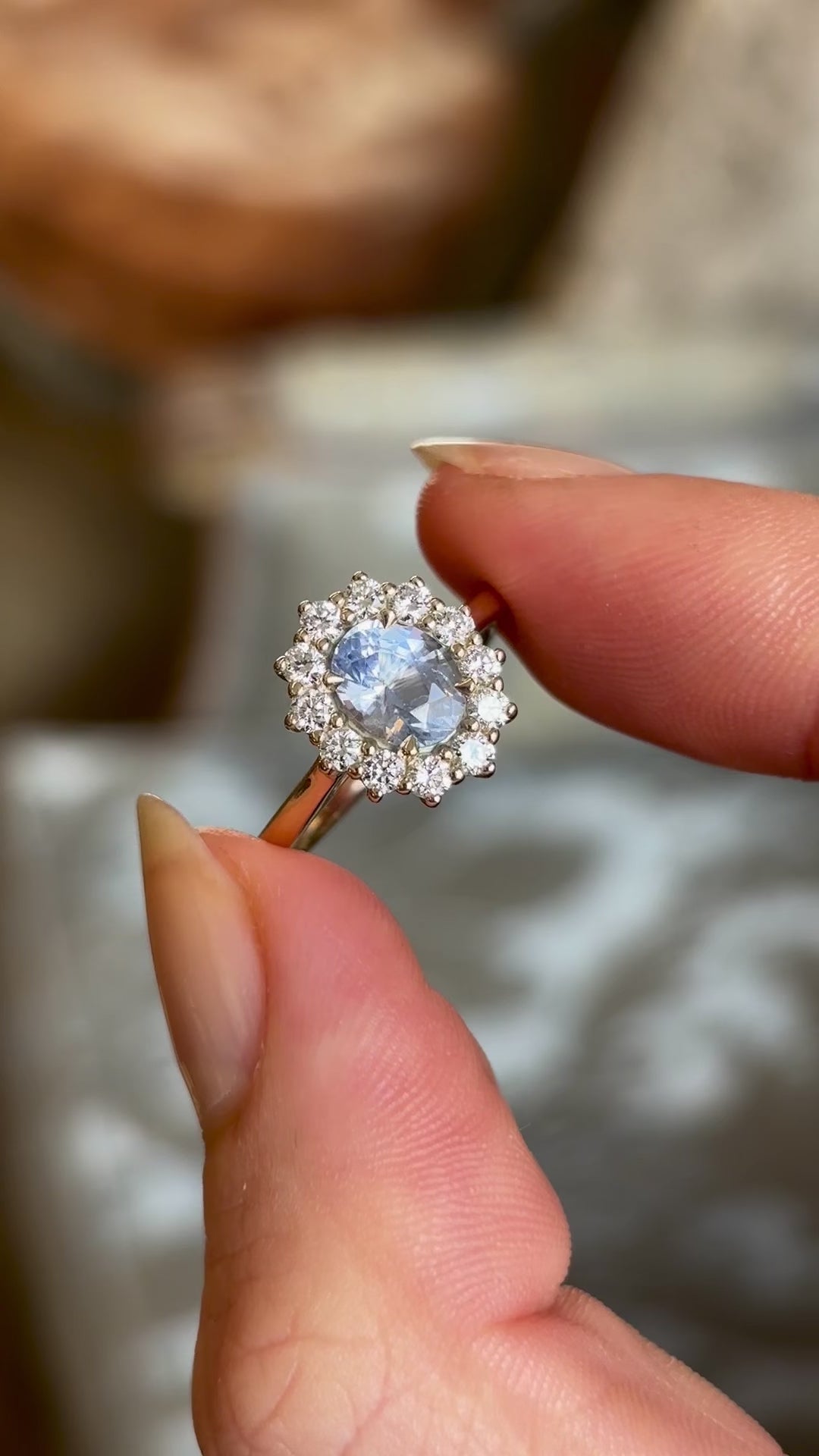 Blue sapphire and diamond cluster engagement ring