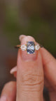 Video showing the claw-set blue sapphire and two brilliant-cut diamonds of this three-stone engagement ring.