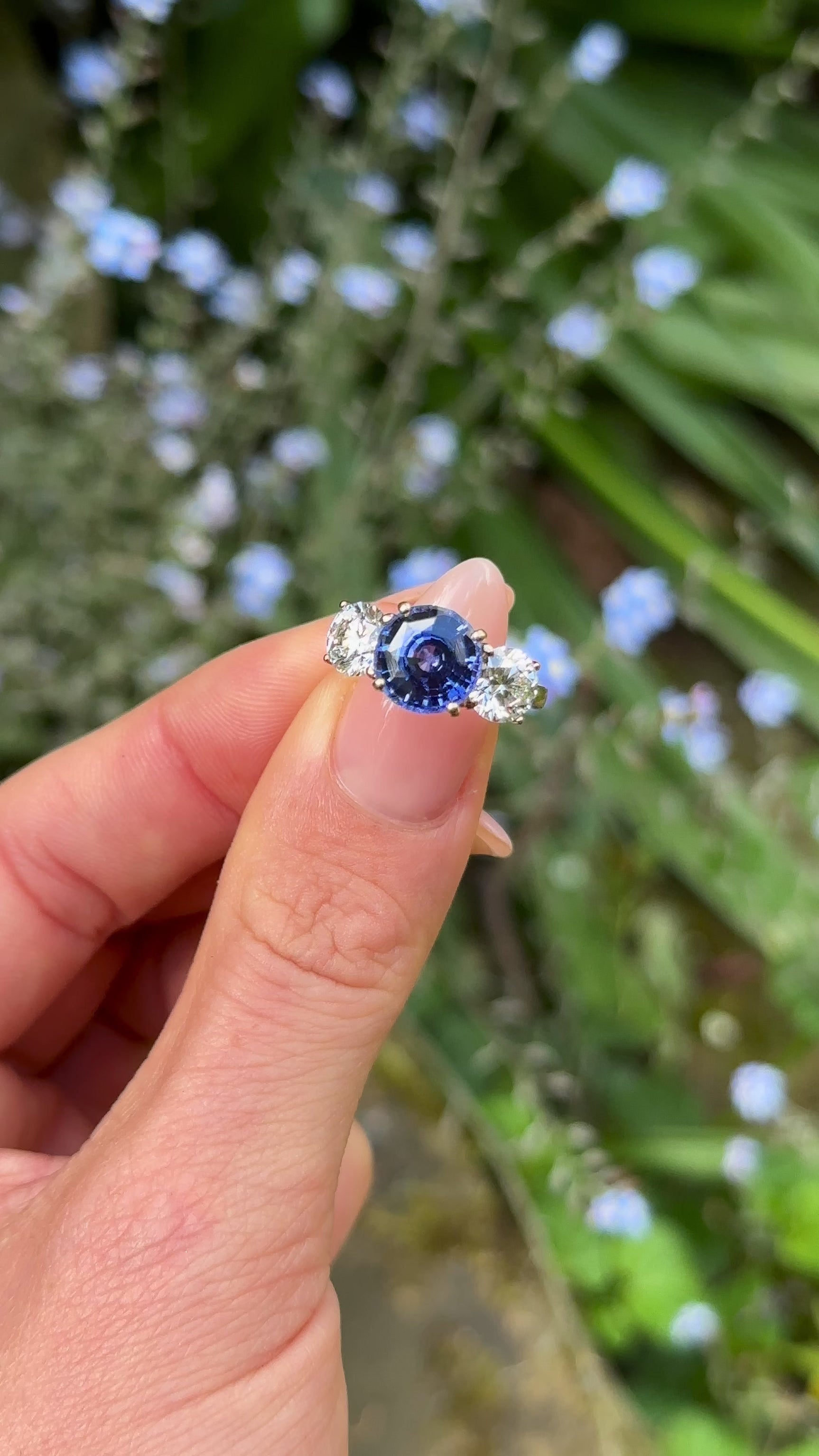 Vintage, 4ct Sapphire and Diamond Three-Stone Engagement Ring worn on hand.