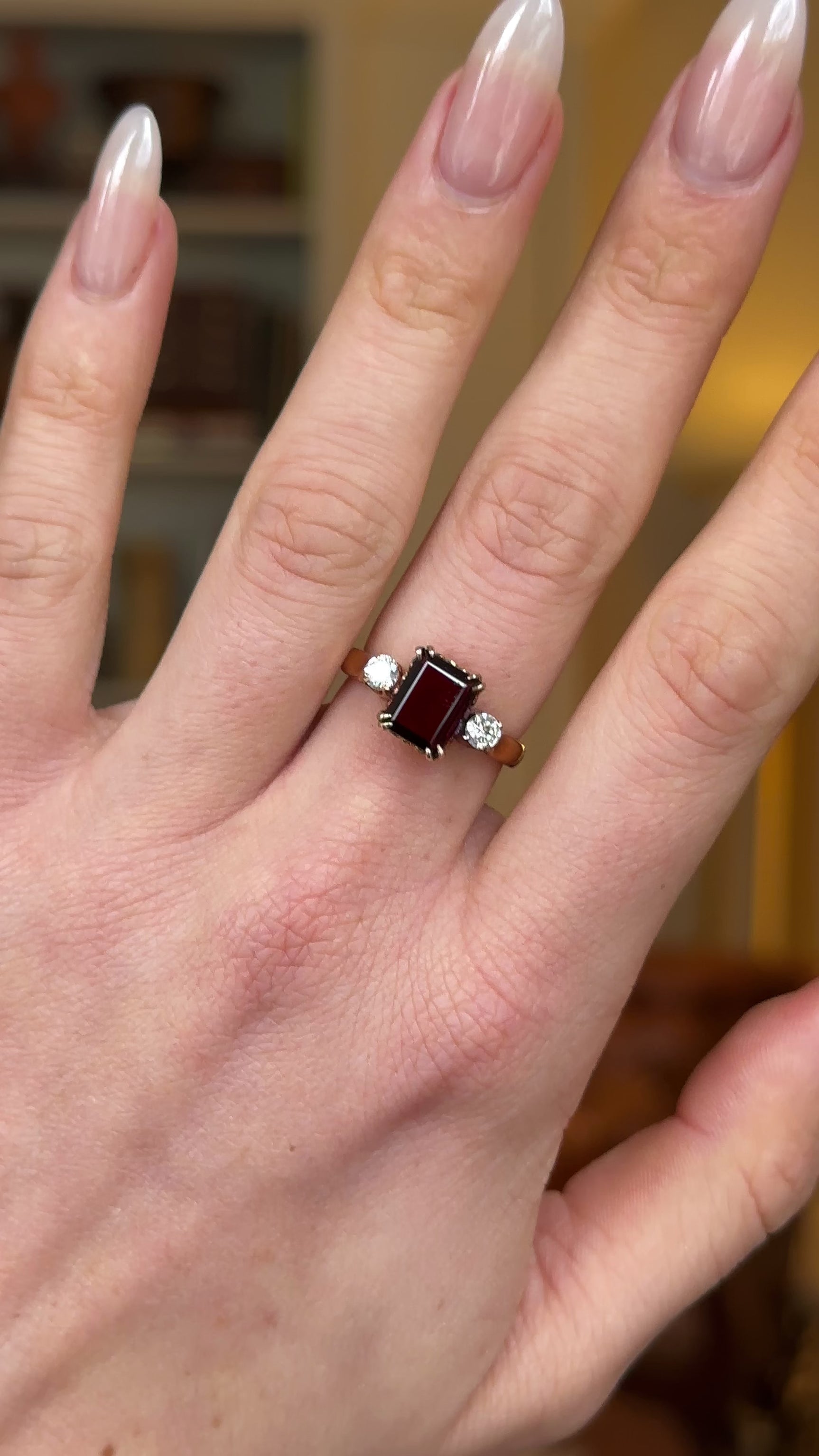 Vintage, 1940s Three-Stone Garnet and Diamond Ring, 18ct Rosy Yellow Gold worn on hand and rotated to give perspective.