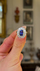 Vintage, 1980s Sapphire & Diamond Ring, 18ct Yellow Gold & Platinum held in fingers and rotated to give perspective.