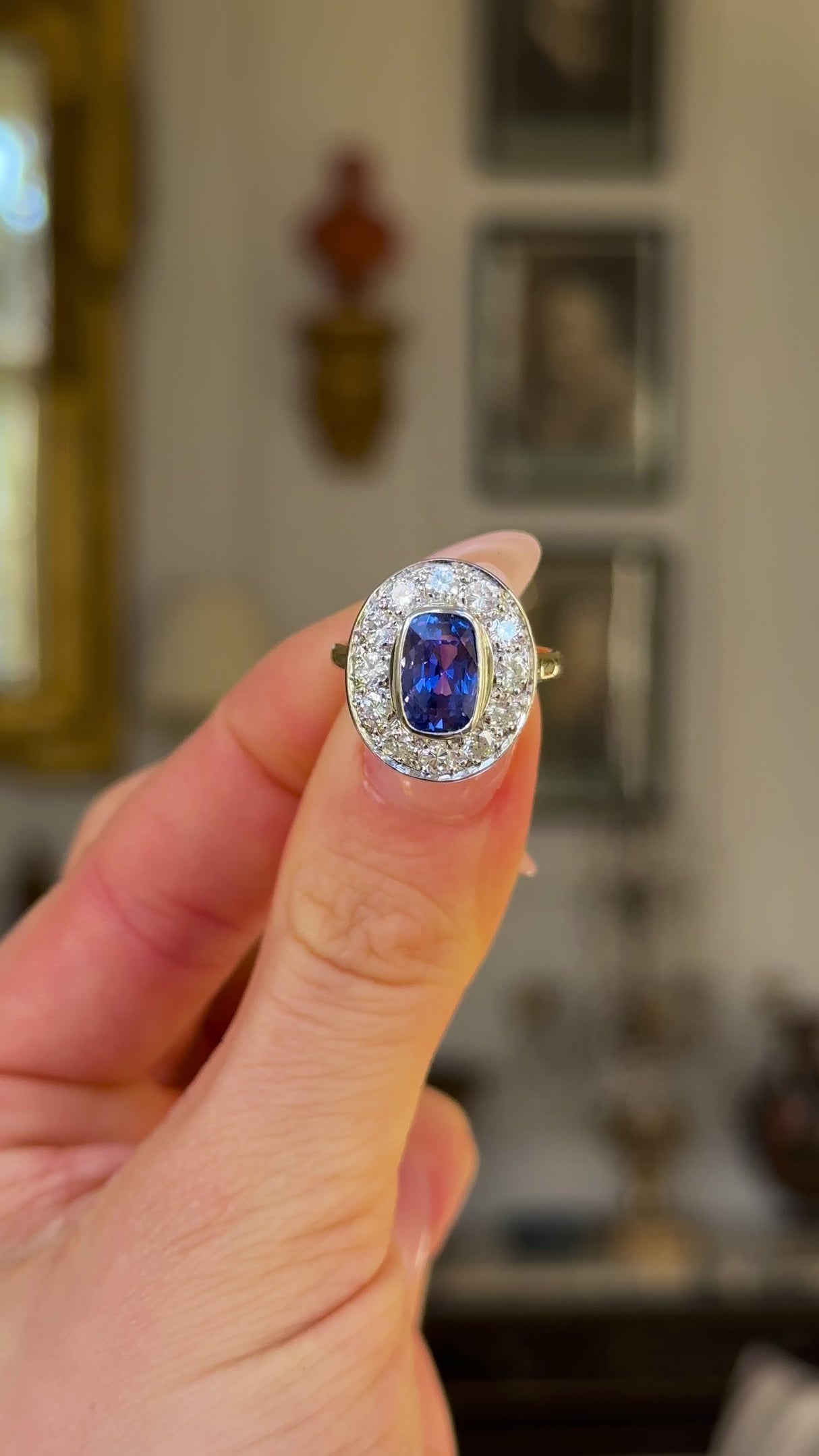 Vintage, 1980s Sapphire & Diamond Ring, 18ct Yellow Gold & Platinum held in fingers and rotated to give perspective.