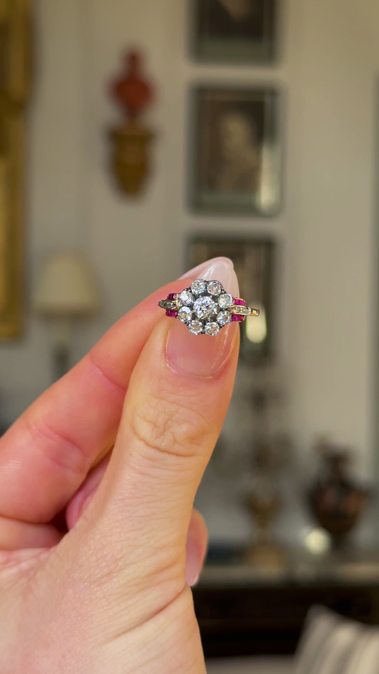 Antique, Victorian Diamond and Ruby Cluster Ring, Yellow Gold held in fingers and rotated to give perspective.