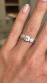 Video of an Antique, Art Deco old-cut diamond three-stone engagement ring in platinum worn on a wedding finger