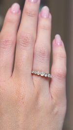 A video of Edwardian diamond seven-stone ring shown at full scale on the hand