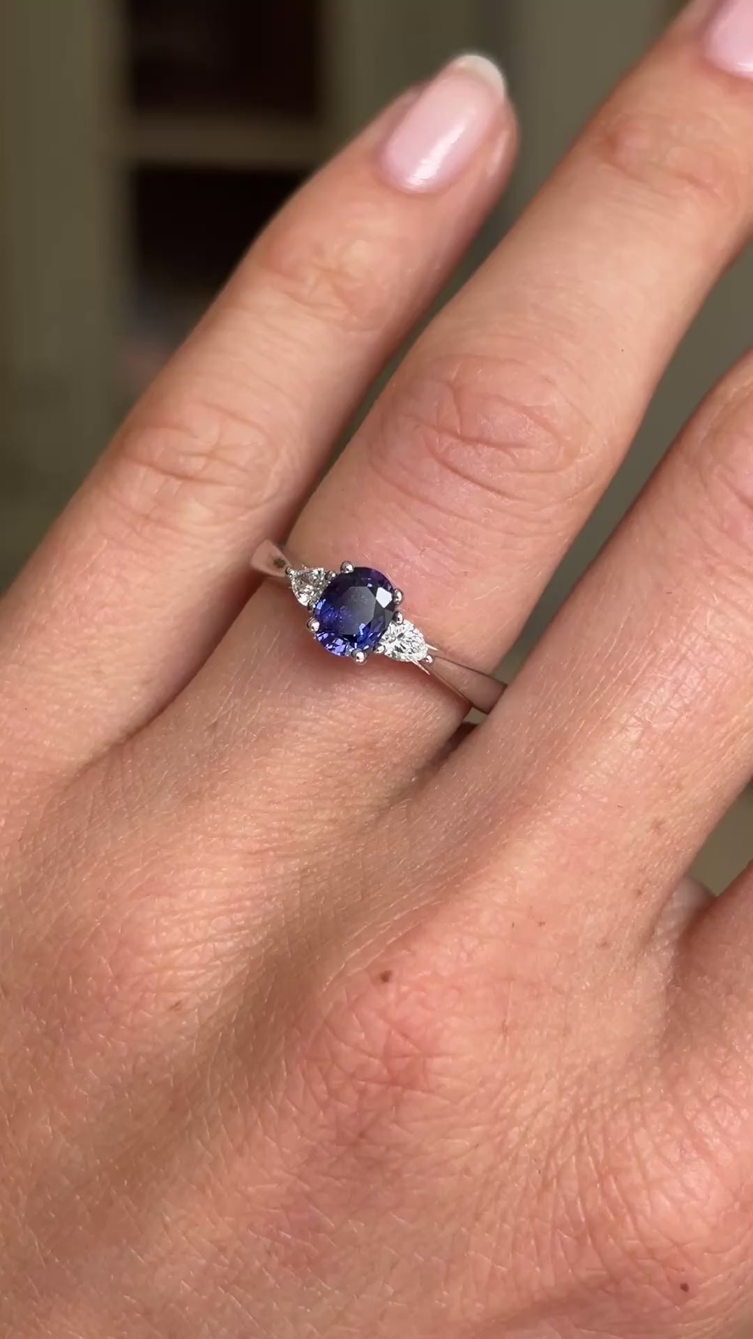 Video of a Vintage-inspired, purple sapphire & diamond three-stone engagement ring in platinum worn on a hand