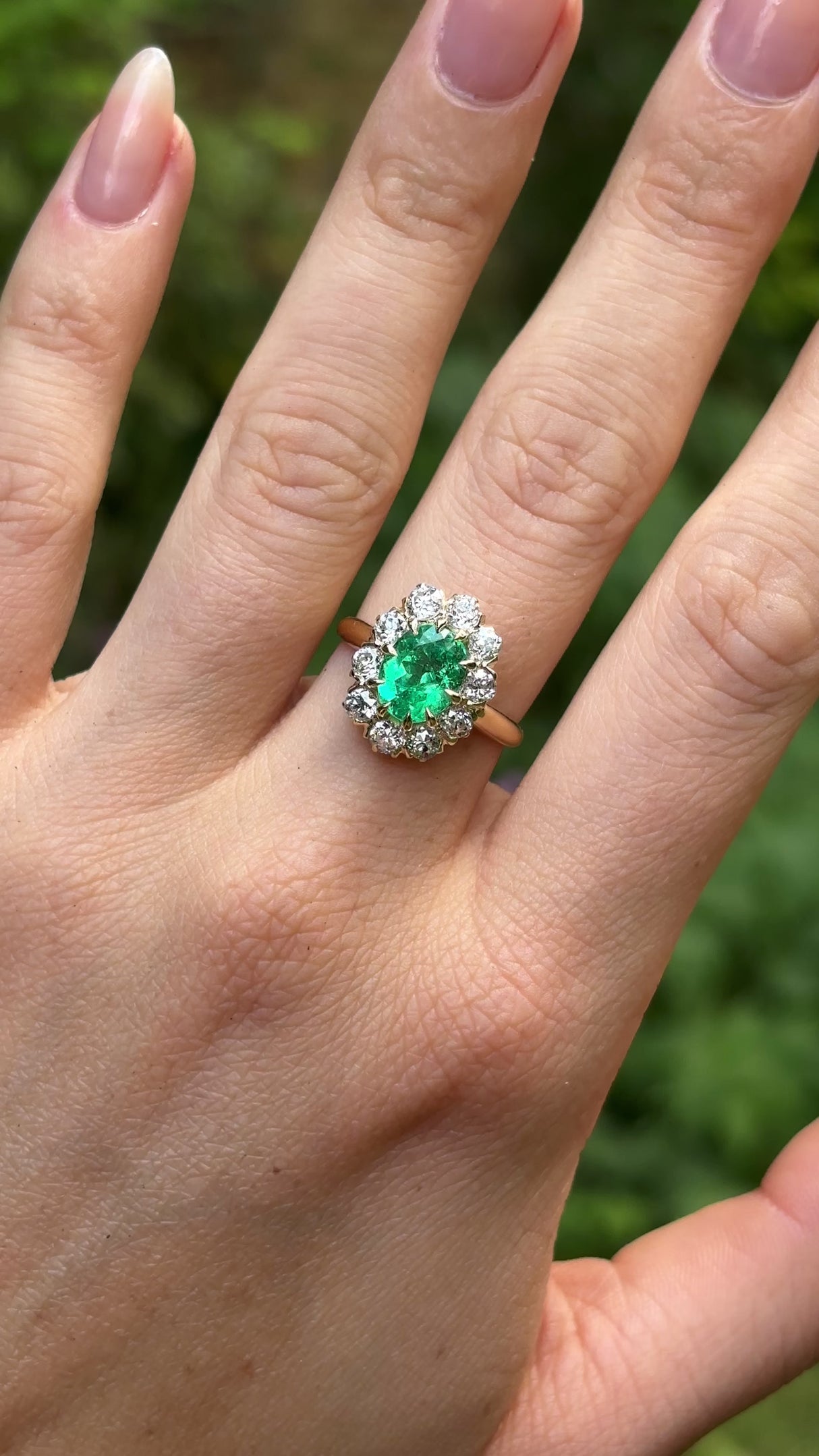 Vintage, Emerald and diamond cluster ring, 18ct yellow gold worn on hand