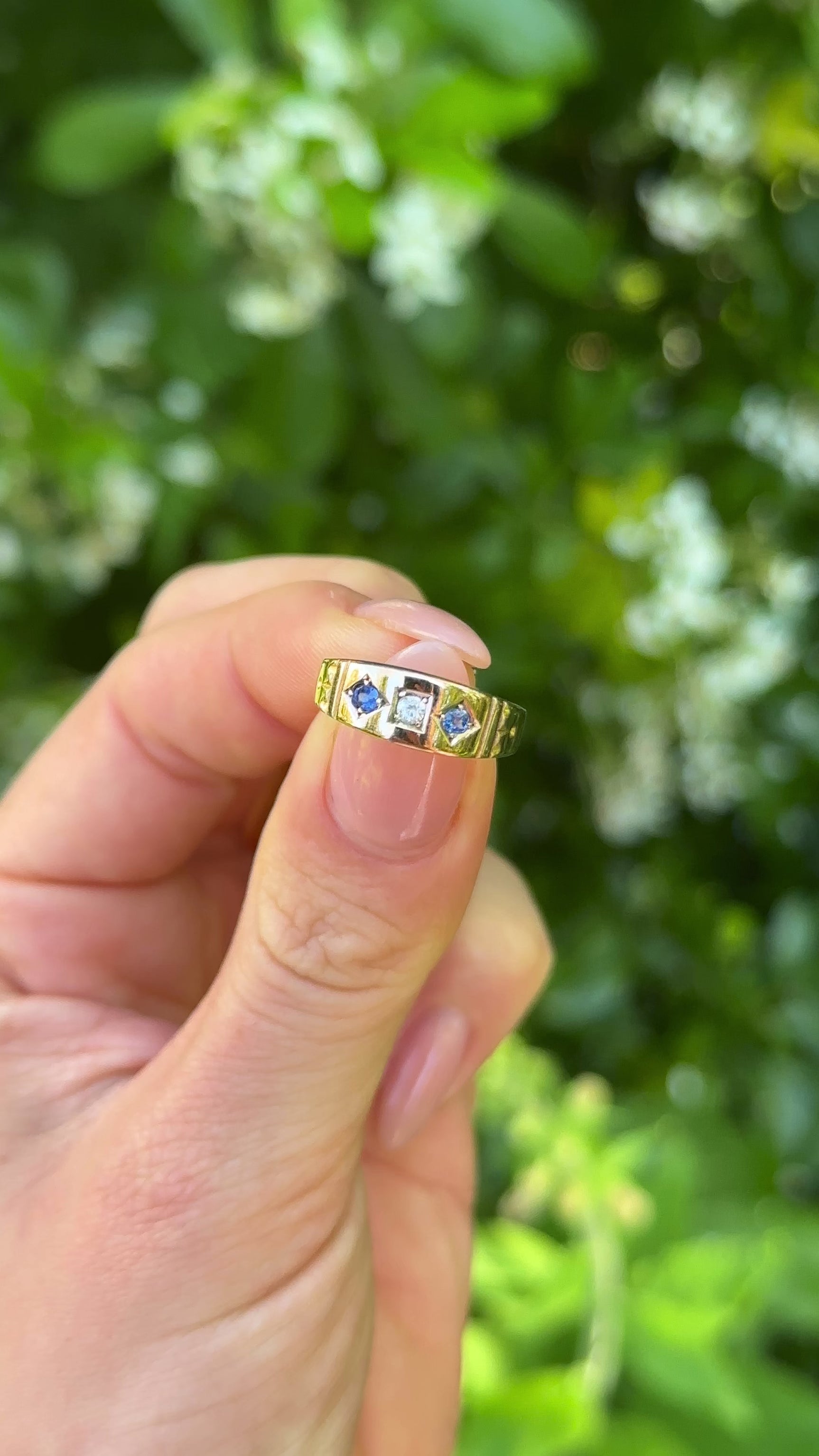 Antique, Victorian Sapphire and Diamond Three-Stone Ring, 15ct Yellow Gold held in fingers.