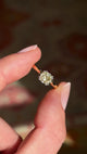 Vintage 1950s brown old-mine cut diamond solitaire engagement ring featuring a brown old-mine cut diamond in a timeless solitaire design, held by hand for detailed viewing.