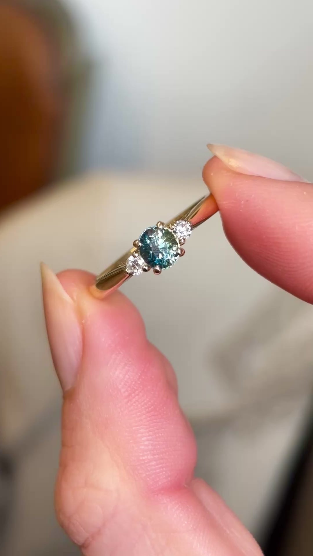 Teal sapphire and diamond three-stone engagement ring