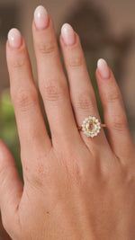 Antique-inspired, yellow sapphire and diamond cluster engagement ring