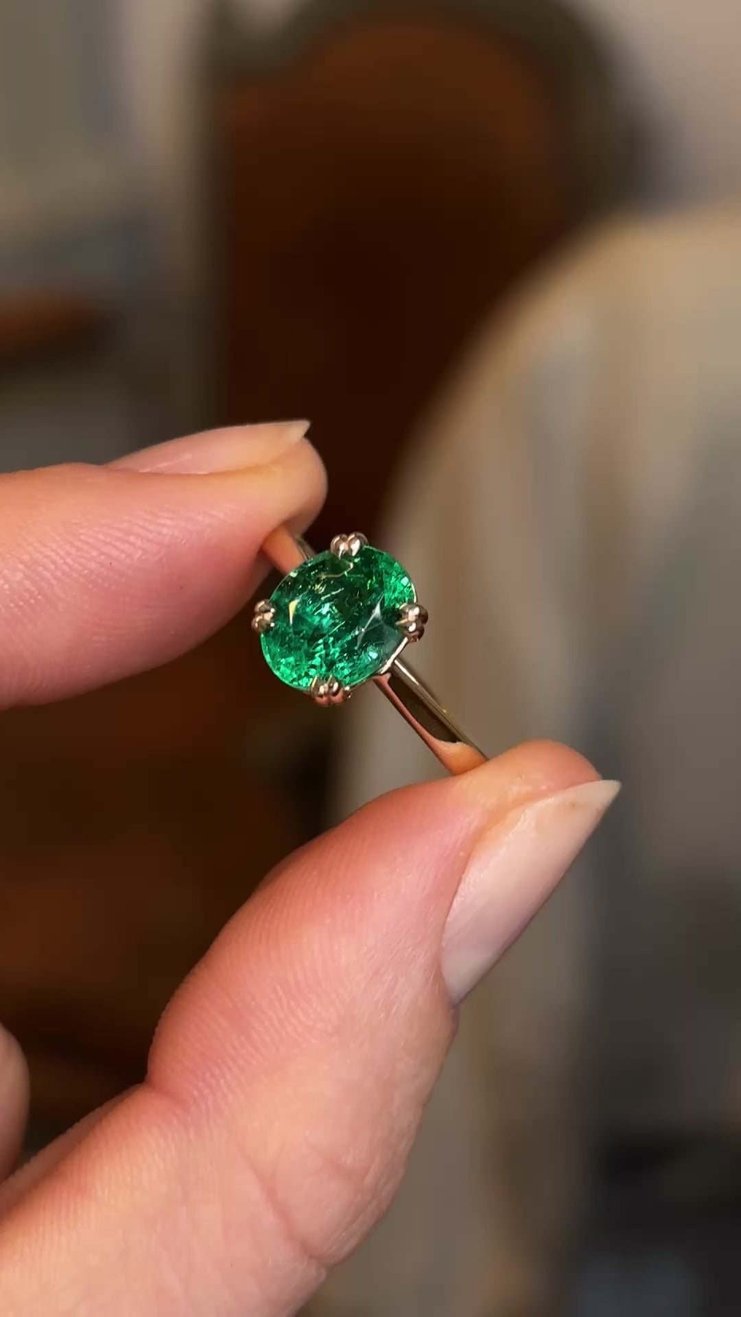 Oval-cut emerald single-stone ring